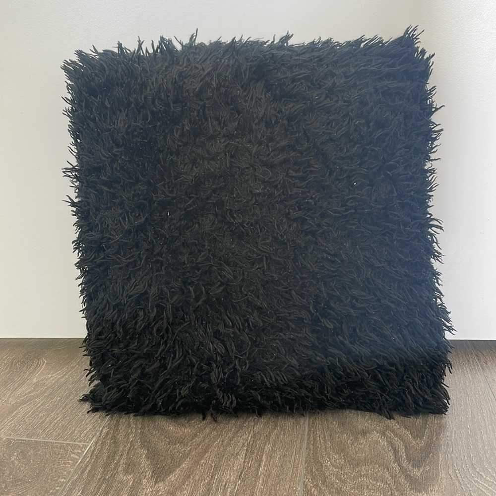 Black shaggy pillow